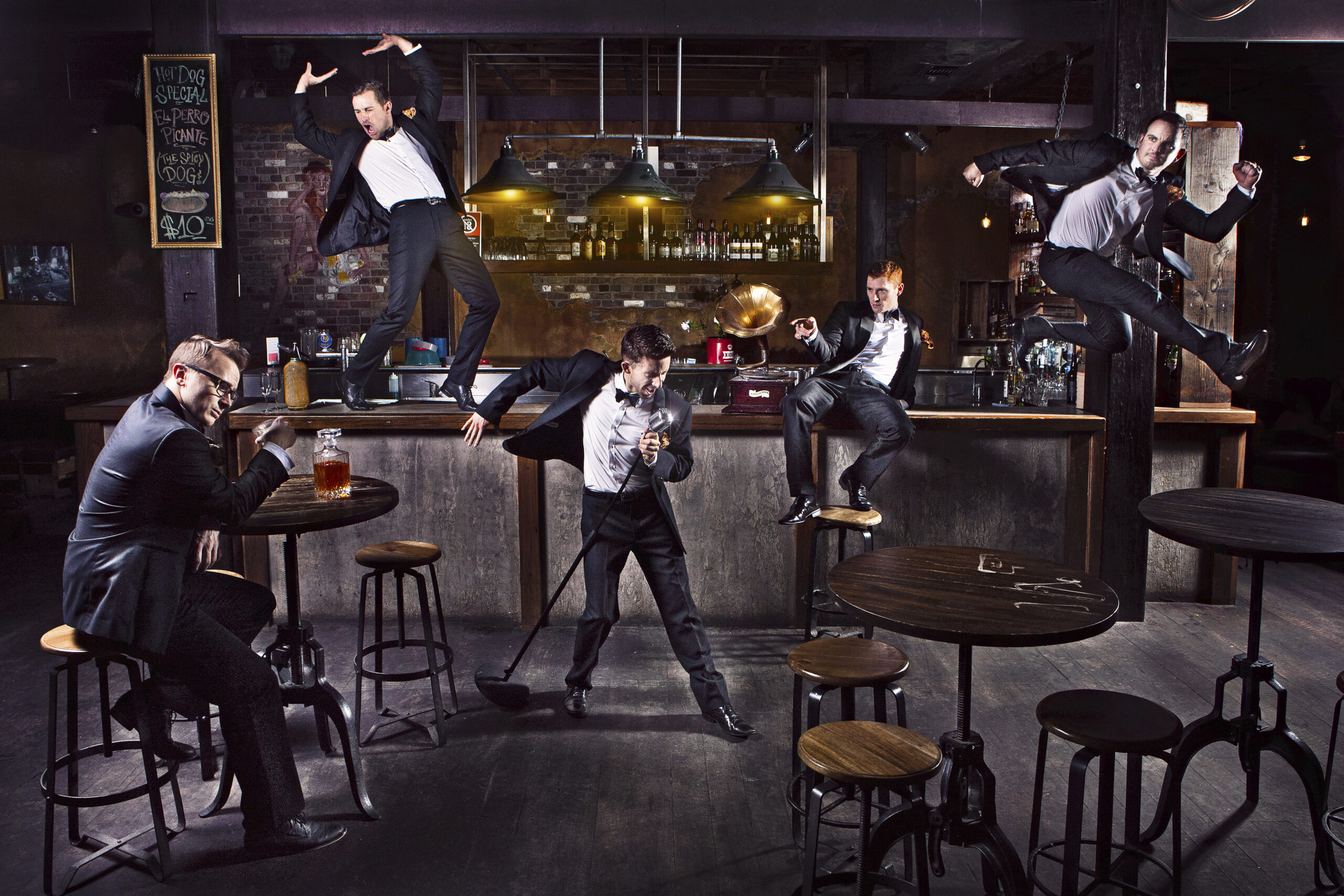 Tap dancers dacing around a bar.